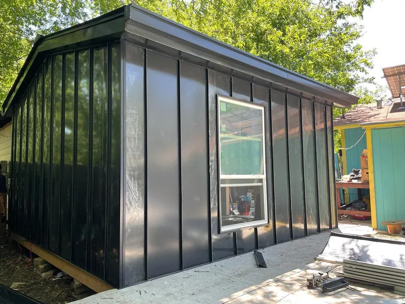 Black standing seam metal wall panels for Roof Inspection in Neosho