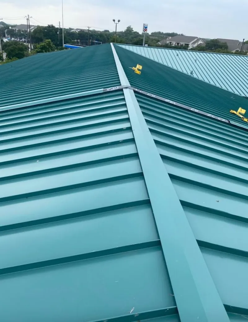 Green commercial metal roof ridge and valley for Metal Roof Repair in Neosho