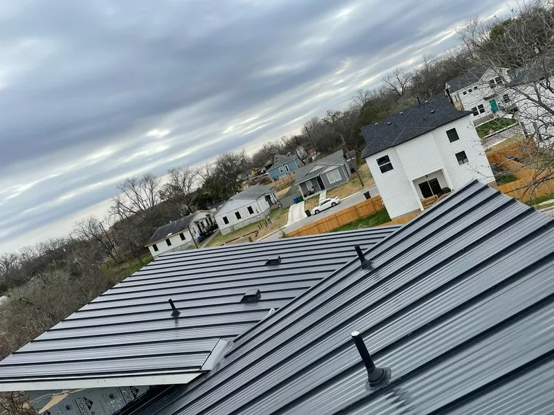 Standing seam metal roof panels with vents for Skylight Repair in Neosho